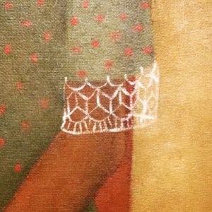 Dettaglio della manica con finitura in pizzo, probabilmente all'uncinetto